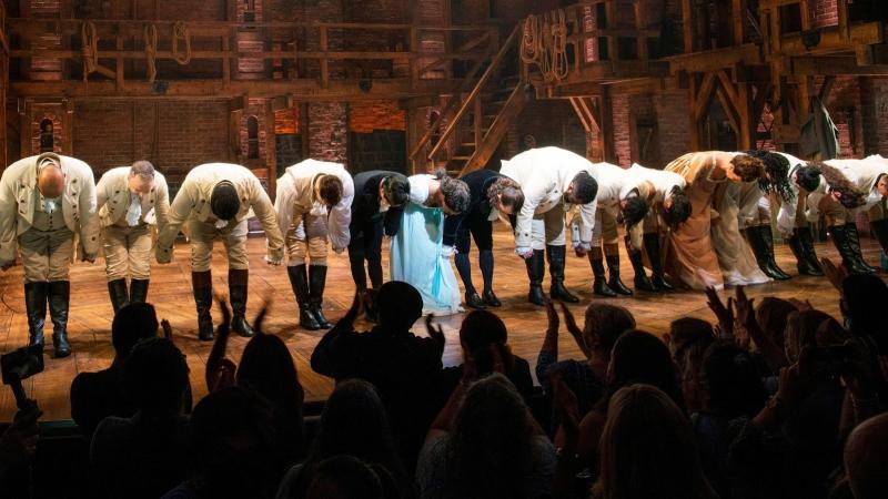 broadway performers bowing at the end of their performance