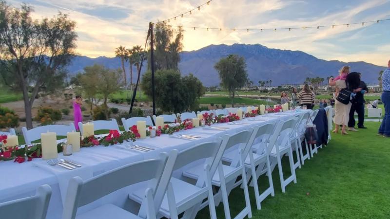 Long table set outdoors at Escena Grill in Palm Springs for an event.