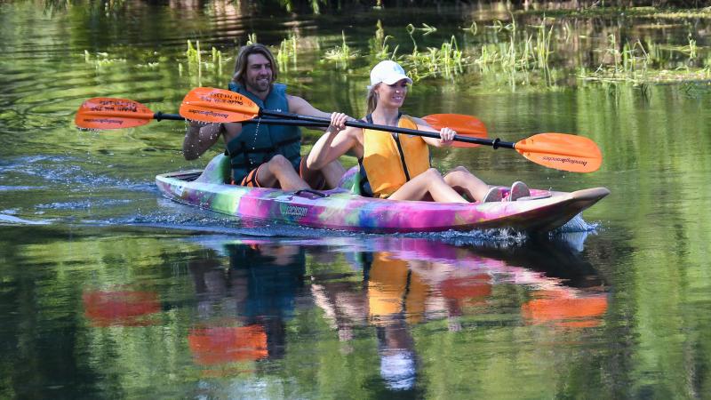 Couple in kayak paddling the San Marcos River