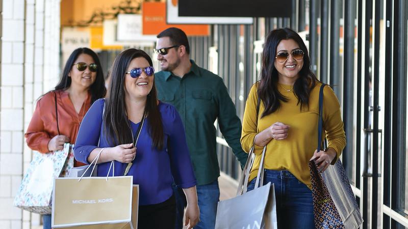 Four shoppers with bags