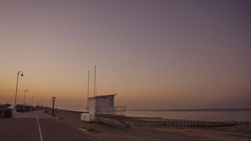 Littlehampton life guard hut and beach at sunset