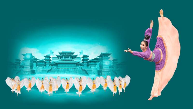 A woman poses while performing in Shen Yun
