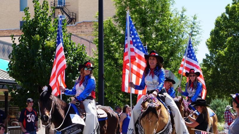 Cowgirls with American Flag at 4th of July Parade