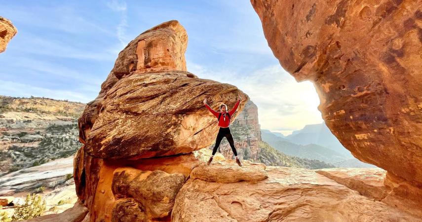 Woman Jumping in Devil's Kitchen in Colorado National Monument