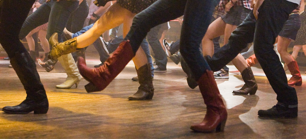 Boots of people participating in country line dancing lessons in Princeton