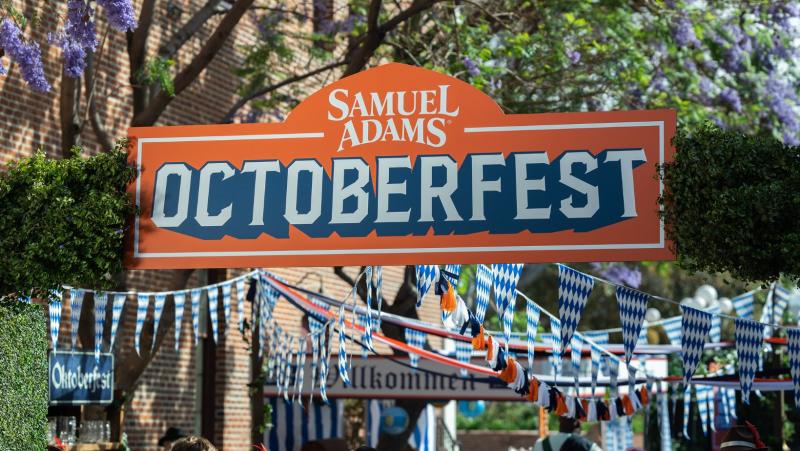 A banner hangs over a walkway that says Samuel Adams Octoberfest