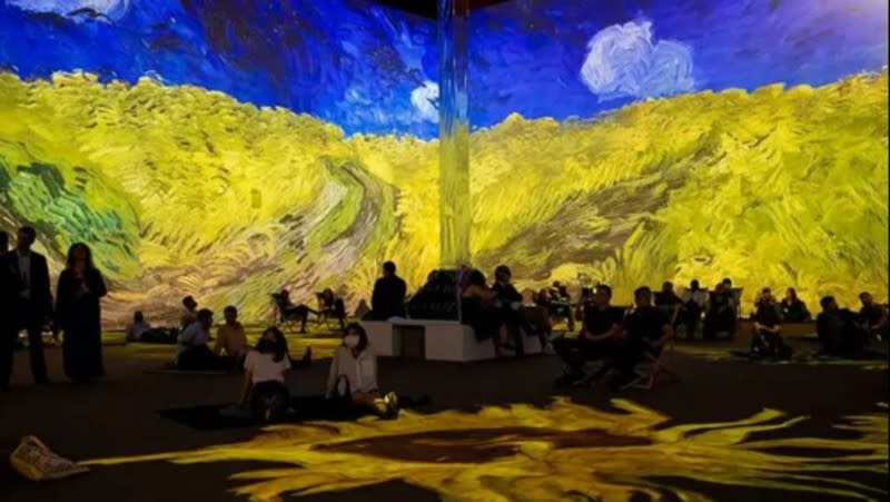 People enjoy the Van Gogh: The Experience exhibit