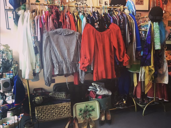 A look at a rack of clothing and other items for sale at Swan Song