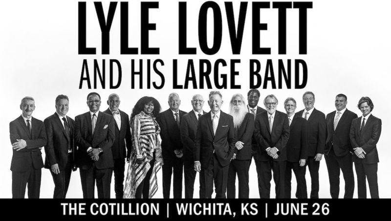 Lyle Lovett poses with his large band