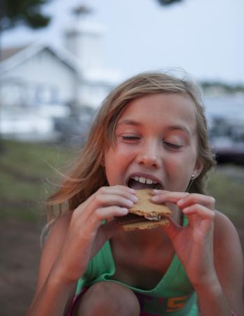 Girl Eating A S'More