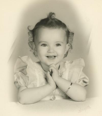 Ava Thompson as a small child wearing gifts from Aunt Ava Gardner