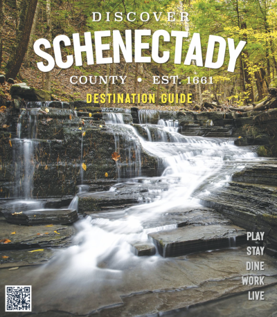 Cover of the 25-26 Schenectady County Destination Guide. Waterfall in the fall.