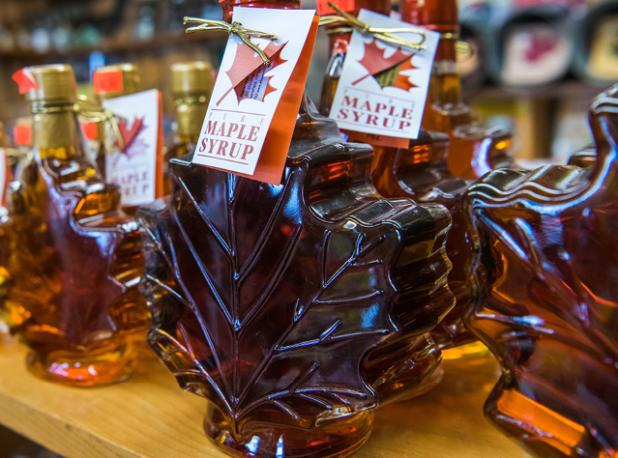 A photo of a maple leaf bottle with maple syrup at Shaver Hill Maple Farm