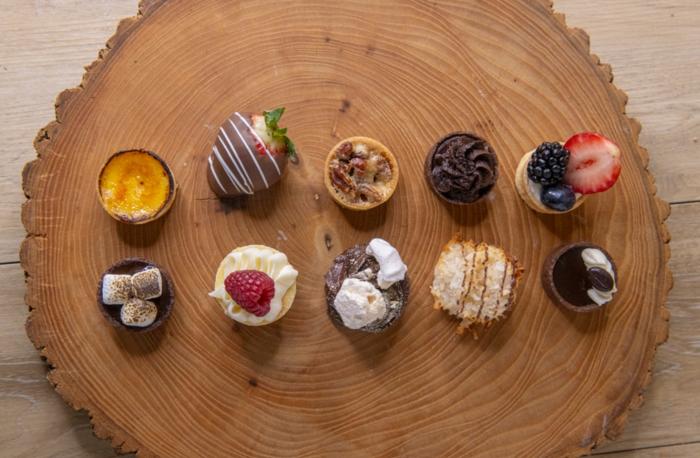 Two rows of desserts, from an aerial view, by Desserts by Dana.