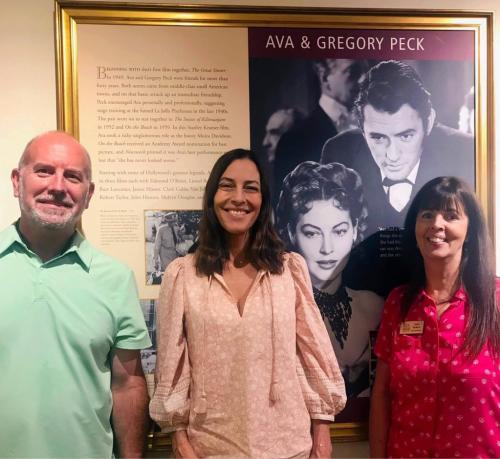 Cecilia Peck with Todd Johnson and Lynell Seabold in front of the Ava & Gregory Peck exhibit