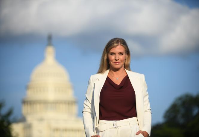 Julie Donaldson in front of the Washington Capitol Building.