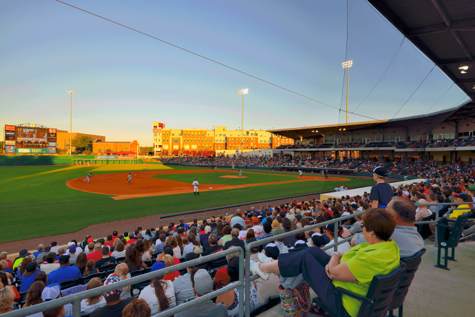 Fans watch a baseball game at the Bowling Green Ballpark.