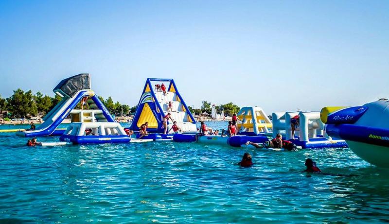 An inflatable assault course on a lake