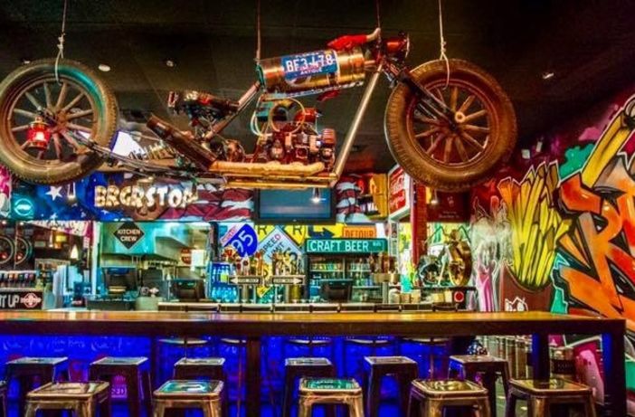 BRGR Stop Fort Lauderdale burger close-up with neon interior