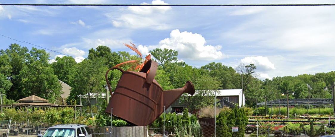 Watering Can Statue - Alexandria - Garden Center