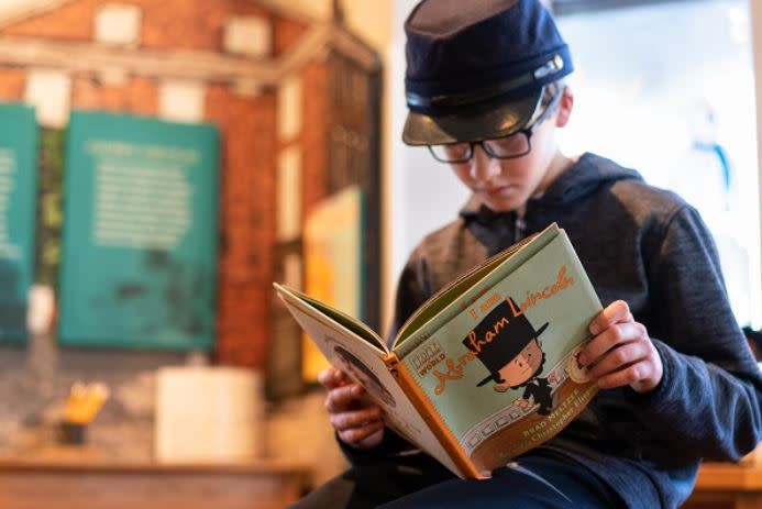 a kid reading story book