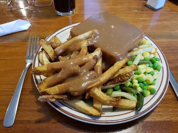 Plate with Sandwich, fries, and green vegetables