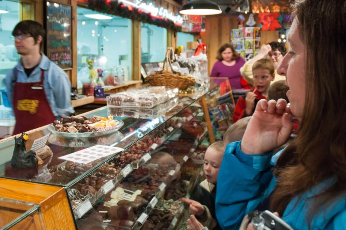 A patron faces a sweet dilemma while choosing treats at Alaska Wild Berry Products.