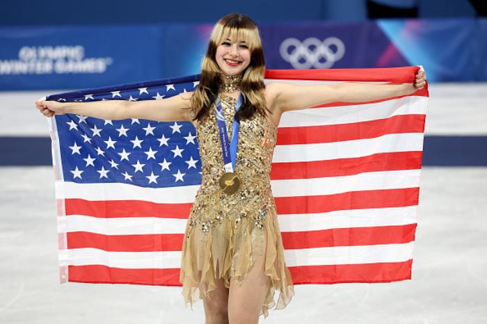 Alysa Liu with gold medal and the USA flag