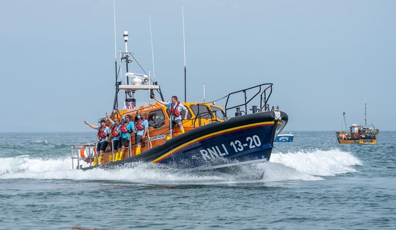 A picture showing a lifeboat with crew on the water