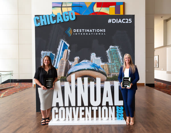 Jill Boggs and Emily Stuck pose with their CDME plaques at the Destinations International Convention in Chicago on July 9, 2025.