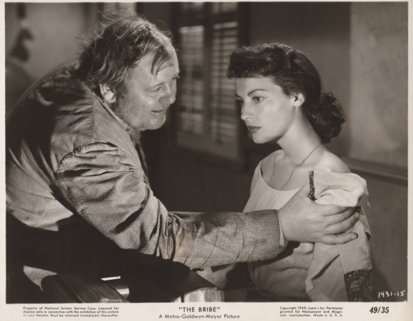 Charles Laughton and Ava Gardner in a scene from the Bribe.