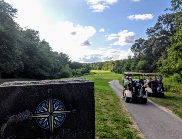 Golf carts along the course at Compass Pointe Golf Course.