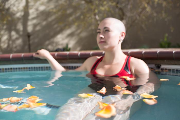 A woman soaks in a hot tub at Betty's Bath & Day Spa