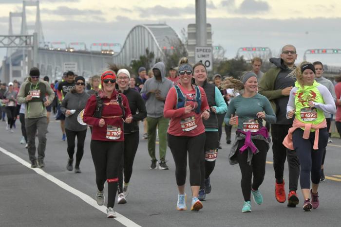 People walking across Chesapeake Bay bridge