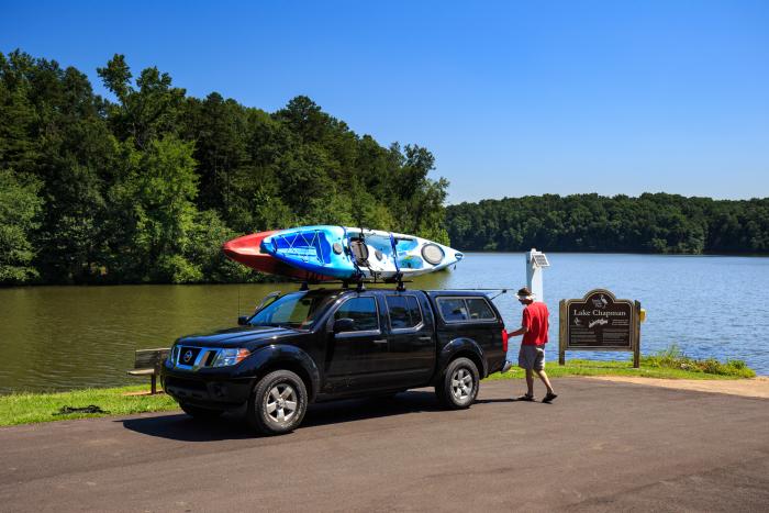 Truck with kayaks in front of Lake Chapman