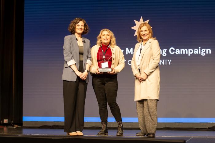 Visit Cook County accepting the 2025 Outstanding Marketing Award at the Explore Minnesota Conference