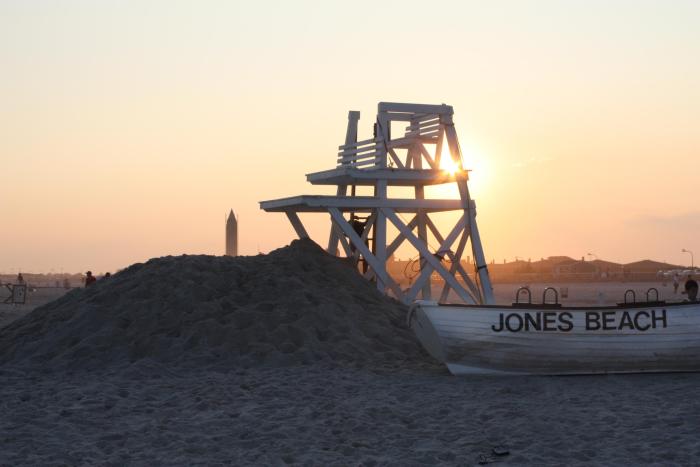 lifeguard chair on the beach during sunset