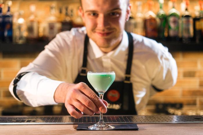 Bartender serving drink