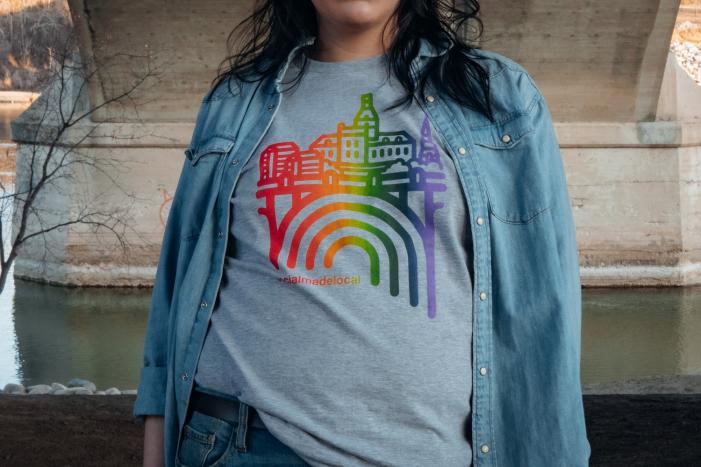 A woman models a pride t-shirt