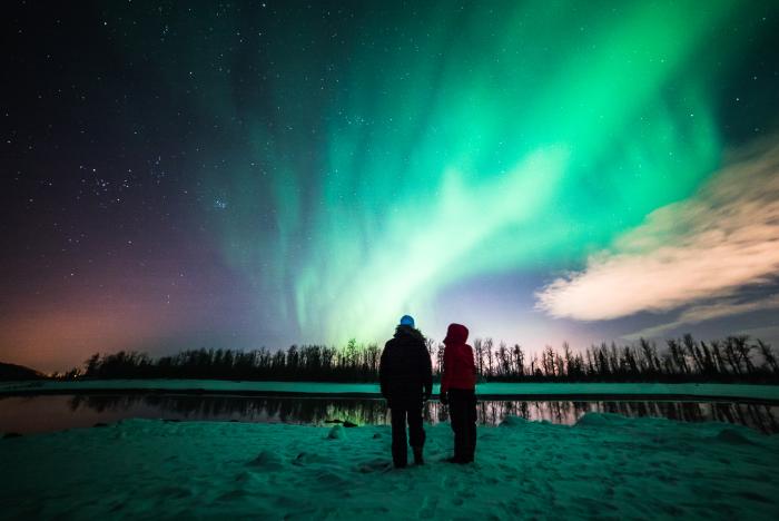 Couple viewing northern lights in the Anchorage area