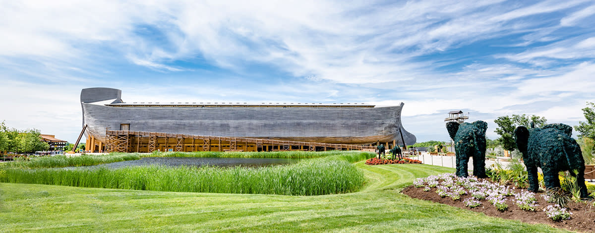 Image is of the Ark in the distance with elephants that have been sculptured from bushes on the right.