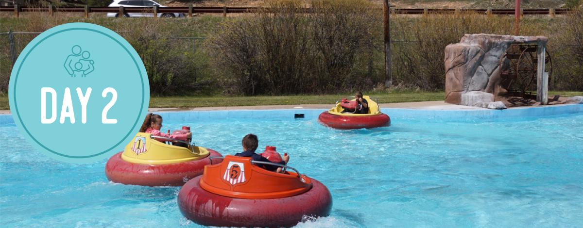 Day 2 in a circle on the left. Picture of people on floaties in a pool.