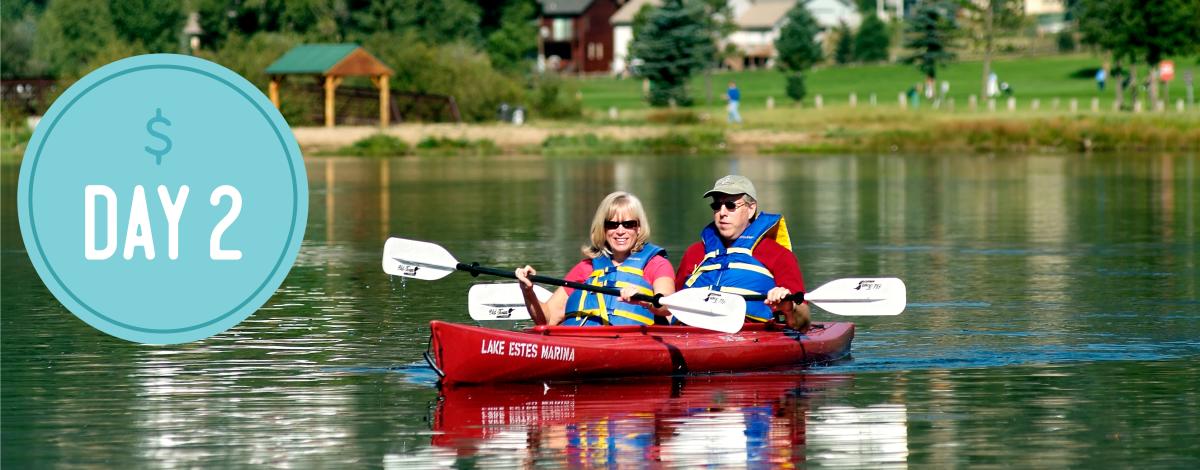 Text in a blue circle reading Day 2. Two people kayaking together on a lake.