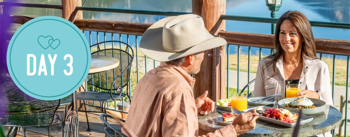 Day 3. Two people eating dinner on a patio.