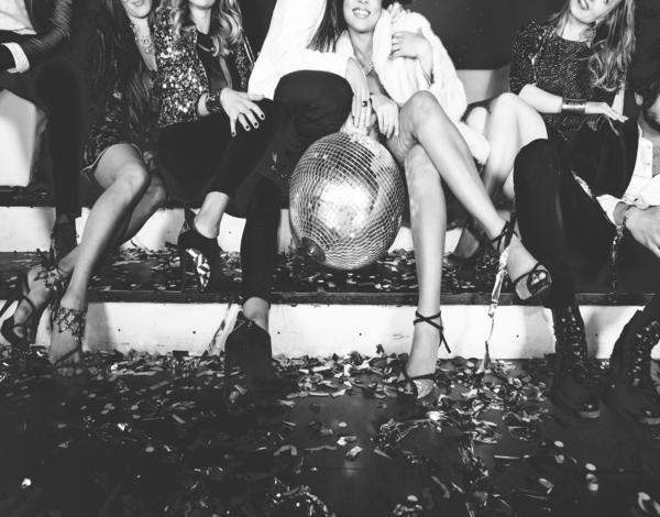 Ladies dressed up with a glitter ball