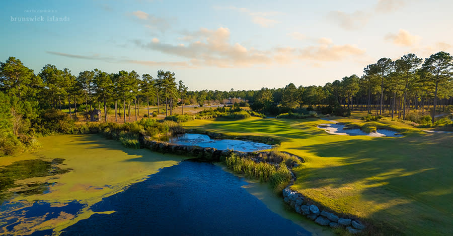 an aerial view of hole #18 at Leopard's Chase Golf Club