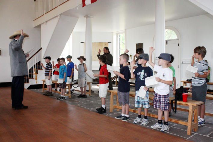 Civil War Interpreter teaching a group of young students