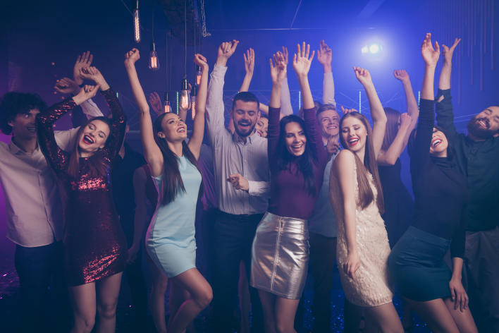 Young adults dancing in a club scene