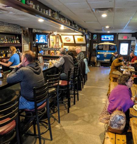 interior photo of picnic tables and bar at wonderbar in covington kentucky