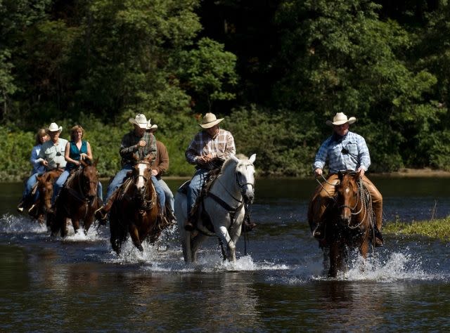 Trail ride through pond at 1000 Acres Ranch (formerly Stony Creek Ranch Resort)